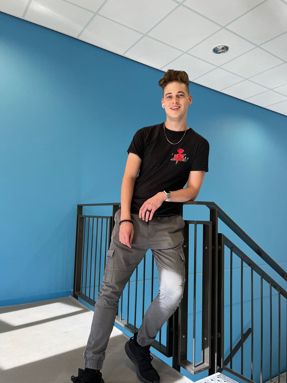 Daan leaning back and smiling